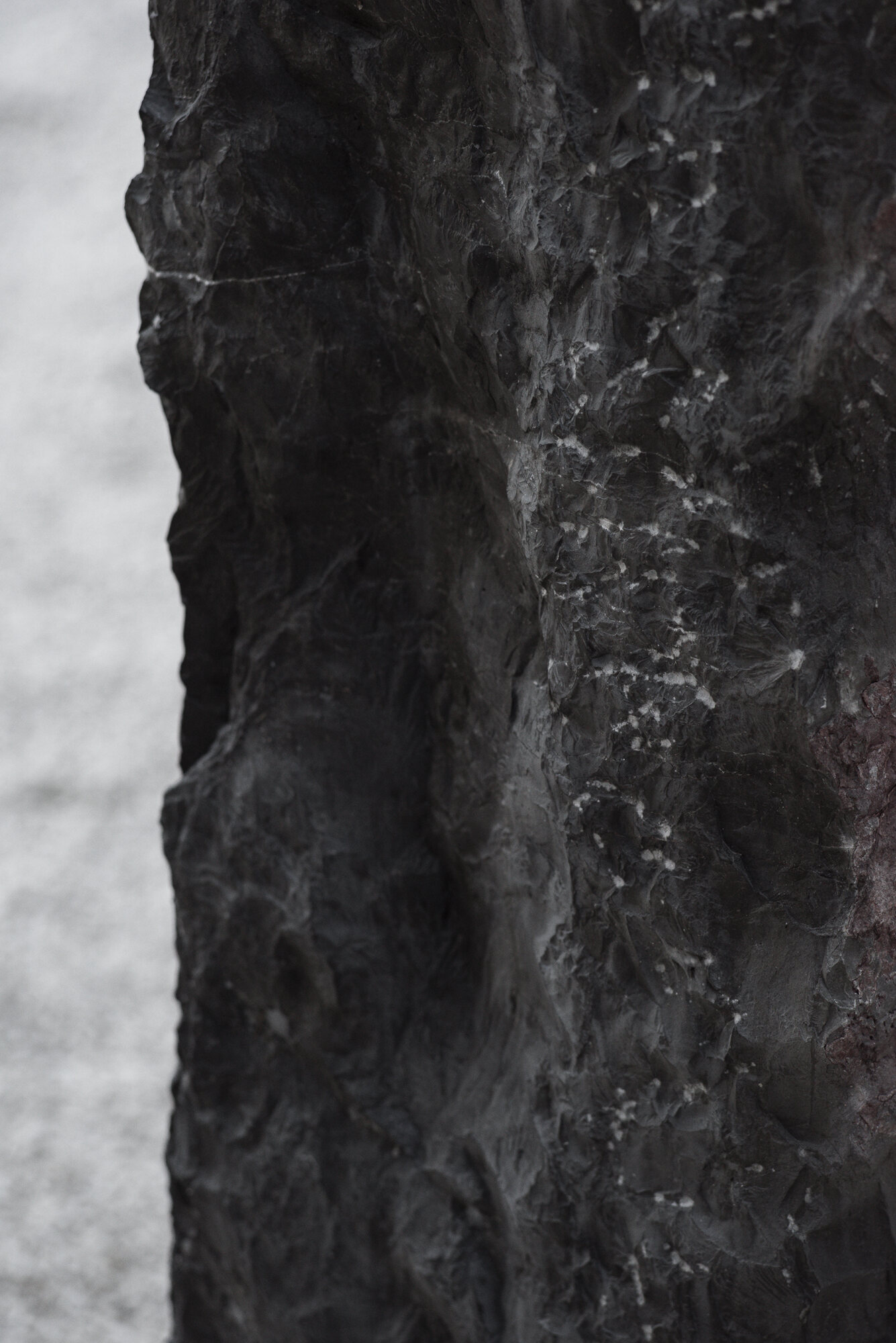 Split face of the dark marble, close