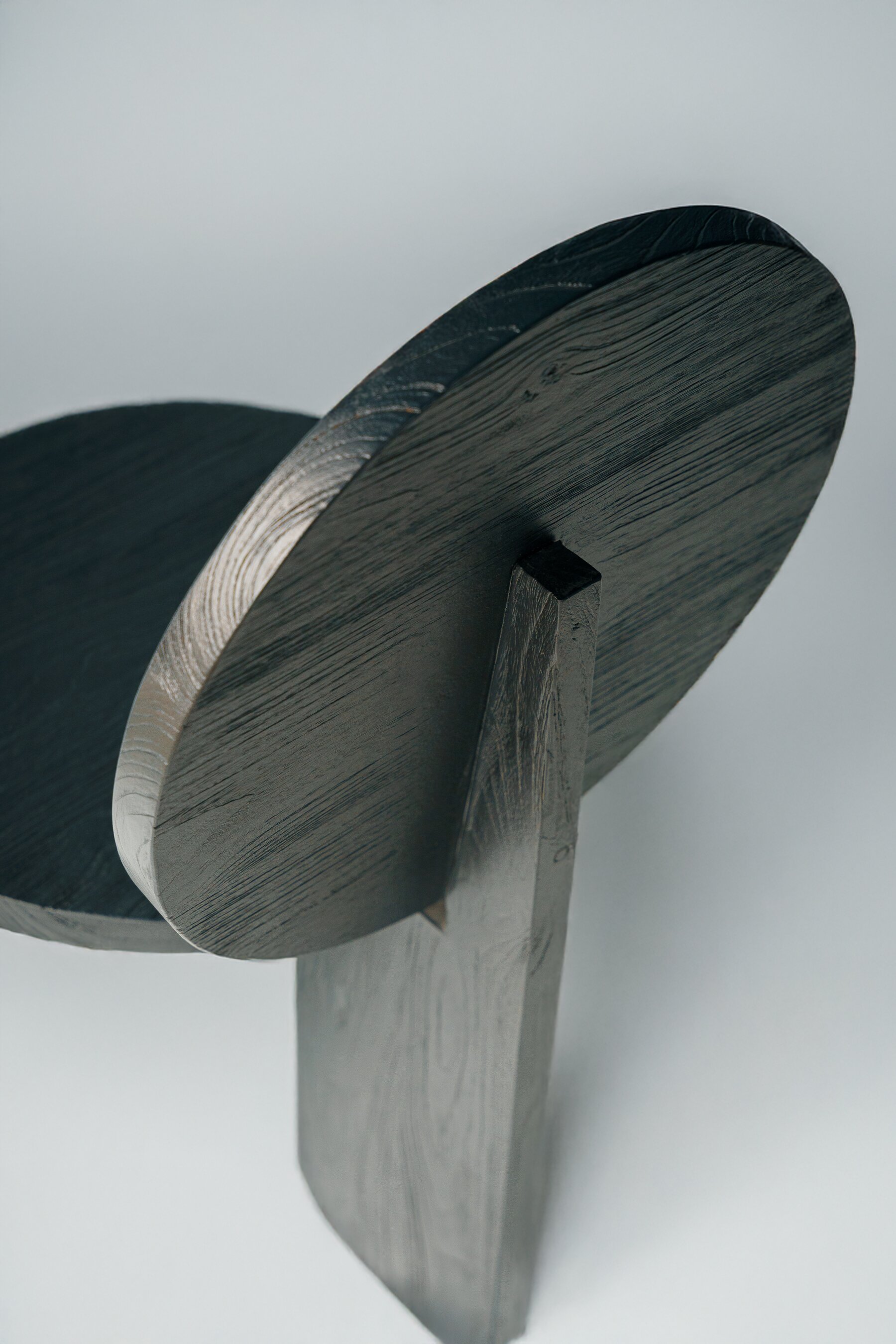 The round back meeting its single upright, from behind
