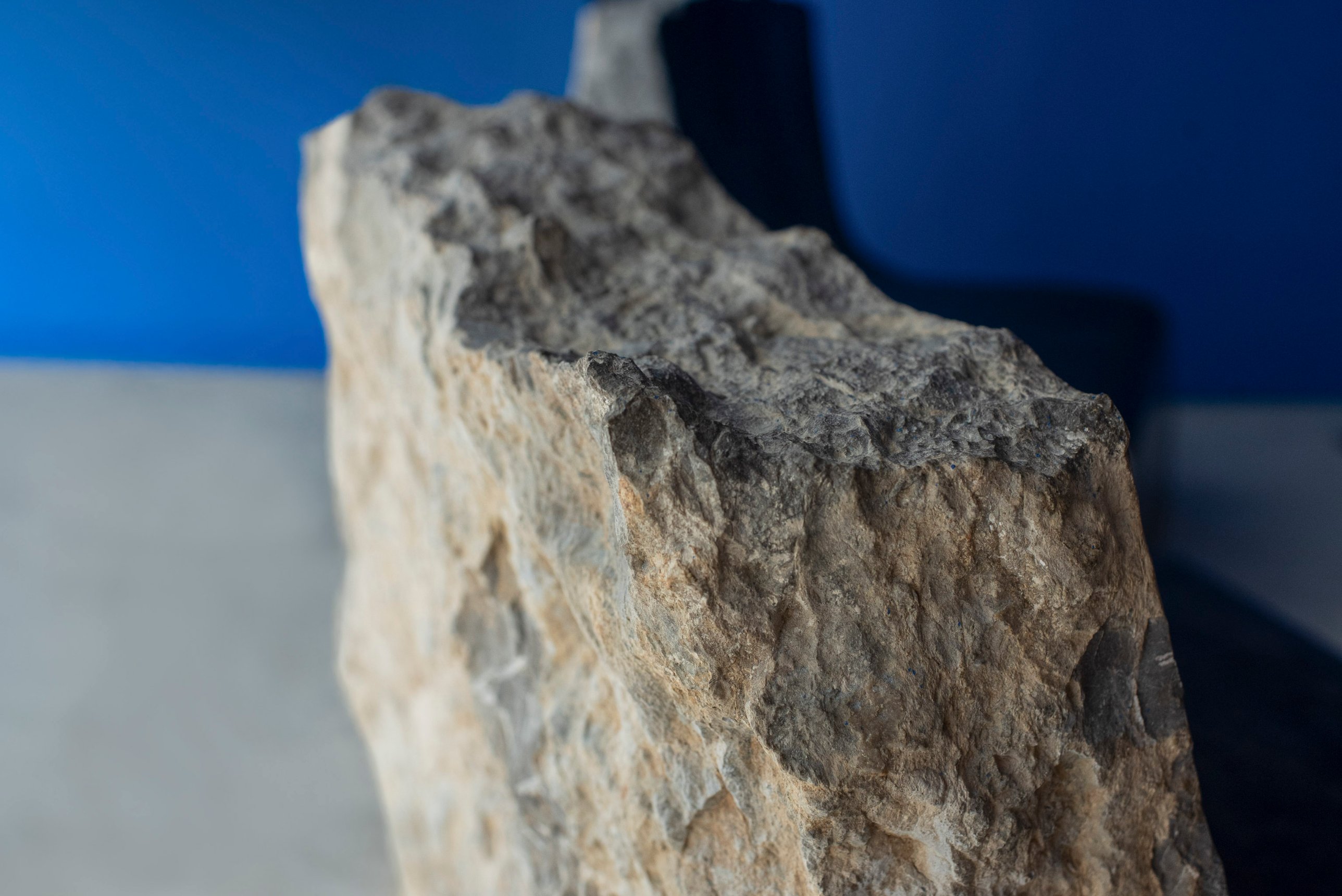 The top edge of the back, the second chair behind