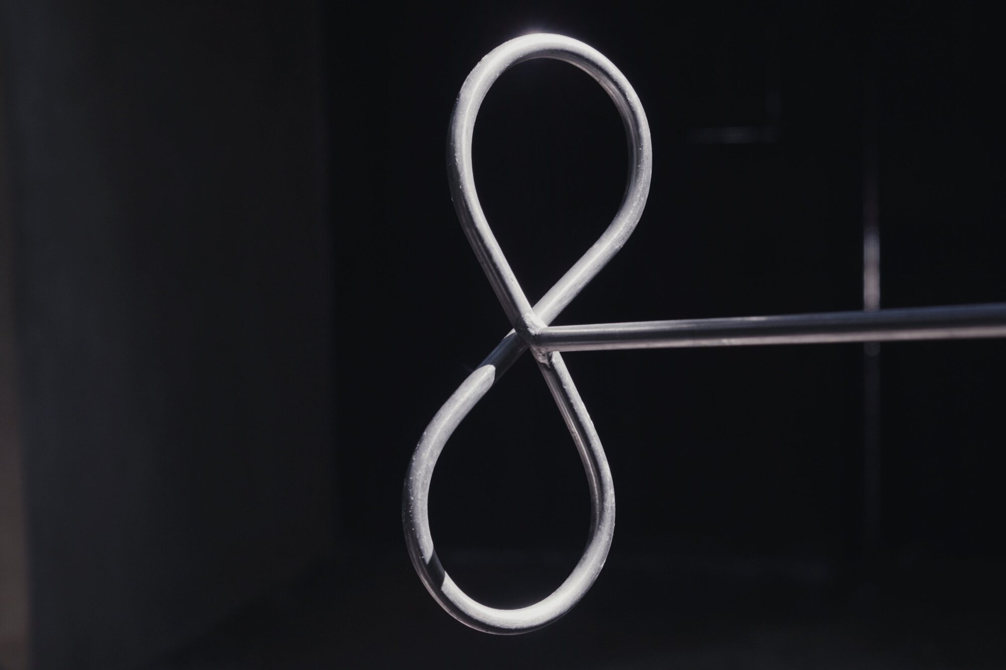 Single steel figure-eight against black
